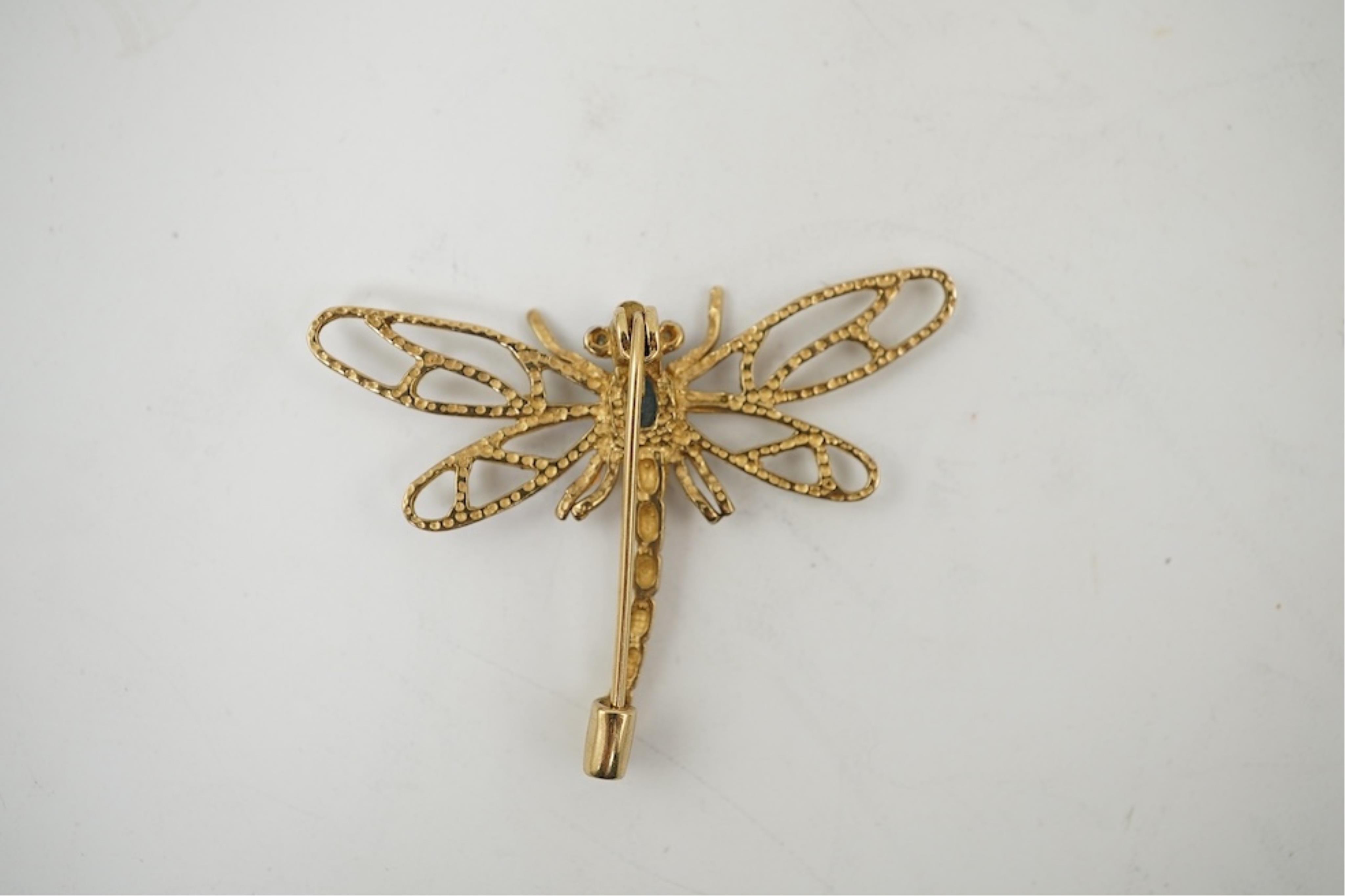 Five assorted modern 375 yellow metal and gem set pendants, a yellow metal and lapis lazuli set pendant (stamped 585?) 40mm, together with a yellow metal dragonfly brooch, a similar small pendant and a white metal bracel